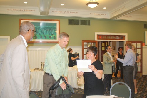 Dean Grant and the committee members preparing for their presentation